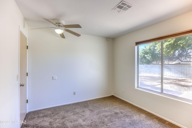 empty room with carpet flooring and ceiling fan