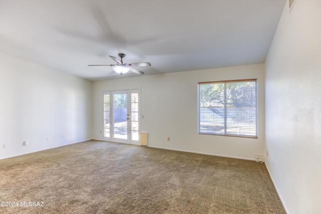 empty room with carpet and ceiling fan