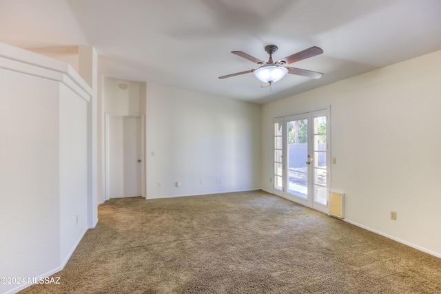 empty room with french doors, carpet floors, and ceiling fan