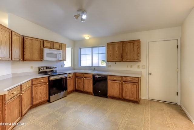 kitchen with dishwasher, vaulted ceiling, stainless steel range with electric cooktop, and sink