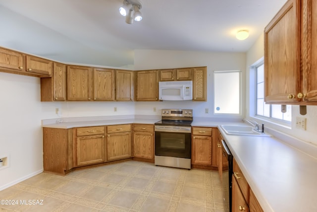 kitchen with electric range, sink, vaulted ceiling, and black dishwasher