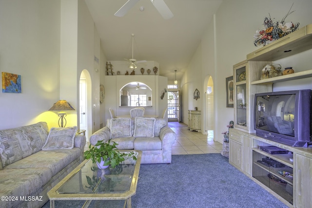 carpeted living room featuring high vaulted ceiling