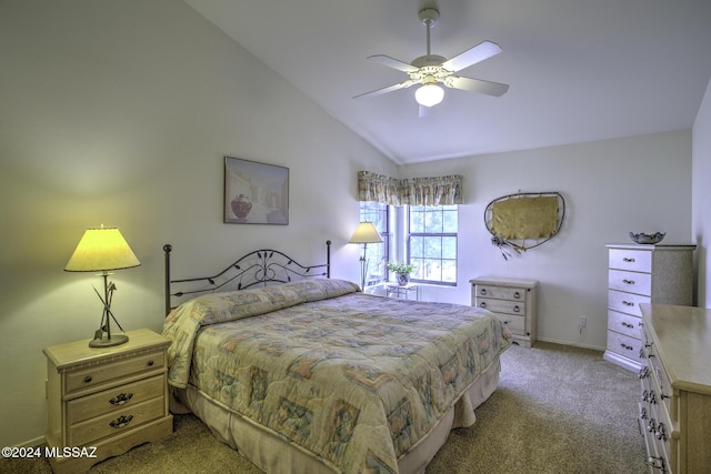 carpeted bedroom featuring ceiling fan and vaulted ceiling