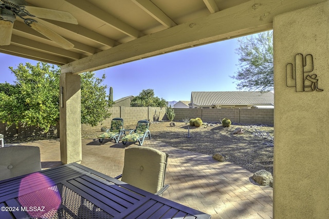 view of patio featuring ceiling fan