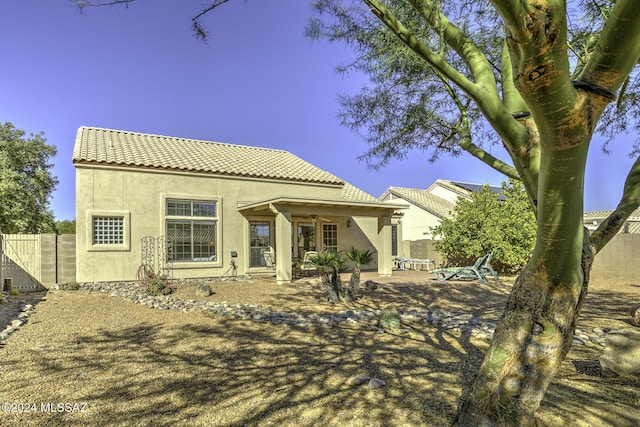 rear view of house featuring a patio area