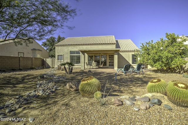 rear view of house featuring a patio