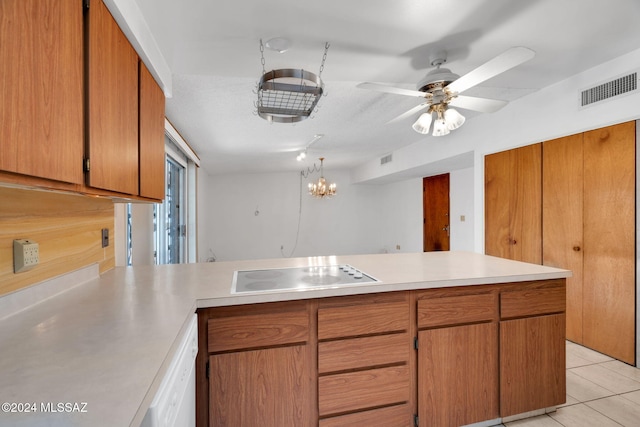 kitchen featuring ceiling fan, white appliances, kitchen peninsula, and light tile patterned floors