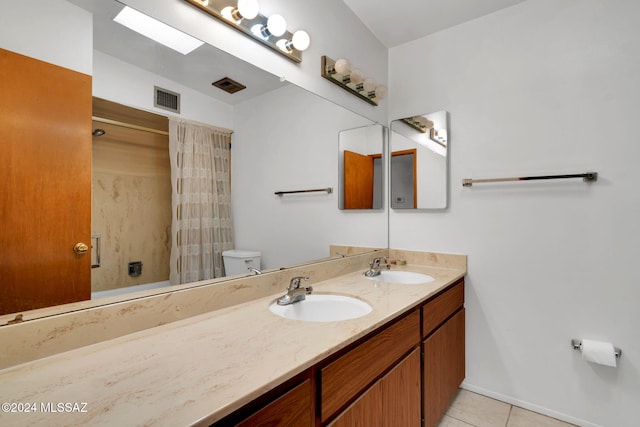 bathroom featuring a shower with curtain, vanity, toilet, and tile patterned flooring