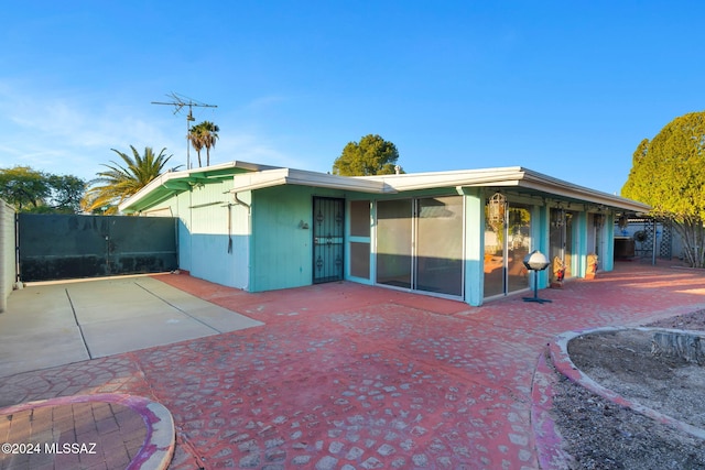 rear view of property with a patio