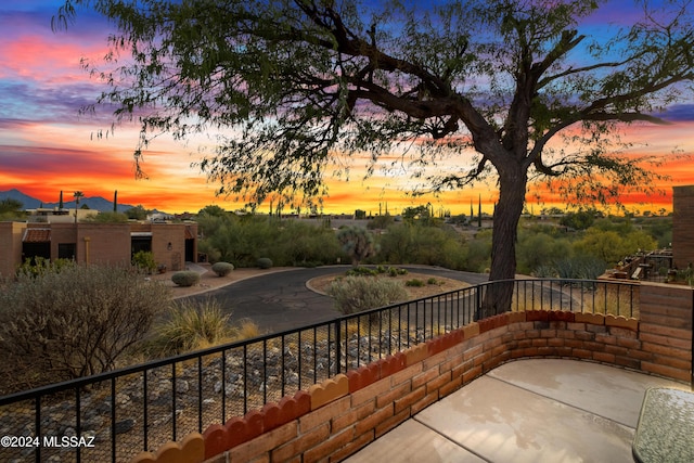 view of patio terrace at dusk