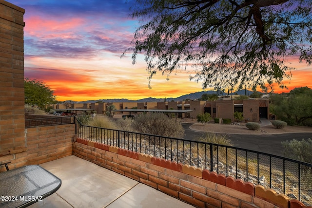 view of patio terrace at dusk