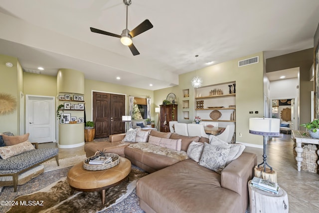 tiled living room featuring ceiling fan