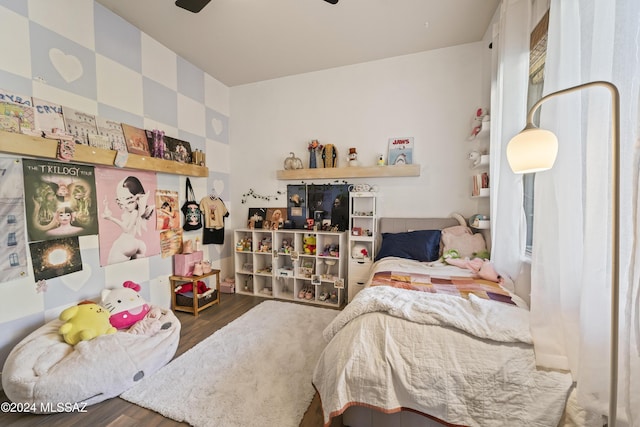 bedroom featuring ceiling fan and dark wood-type flooring