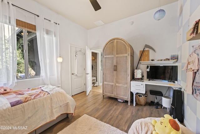 bedroom featuring hardwood / wood-style flooring and ceiling fan