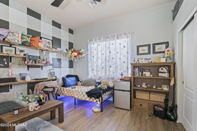 interior space featuring hardwood / wood-style floors and ceiling fan