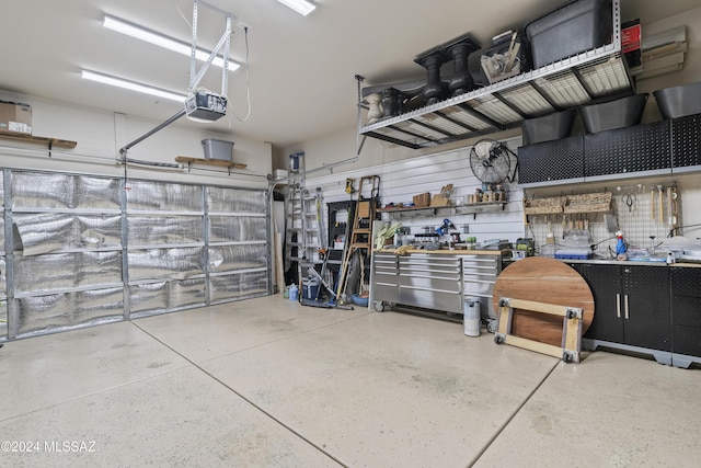 garage featuring a workshop area and a garage door opener