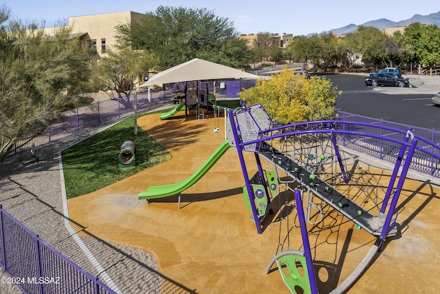 view of community featuring a mountain view and a playground