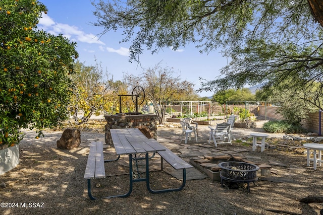 view of patio featuring an outdoor fire pit