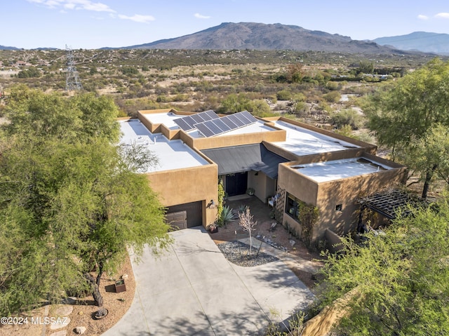 drone / aerial view featuring a mountain view