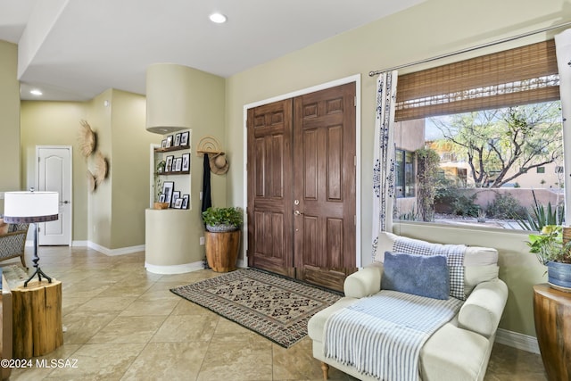 entrance foyer with light tile patterned floors