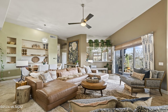 tiled living room with ceiling fan and built in features