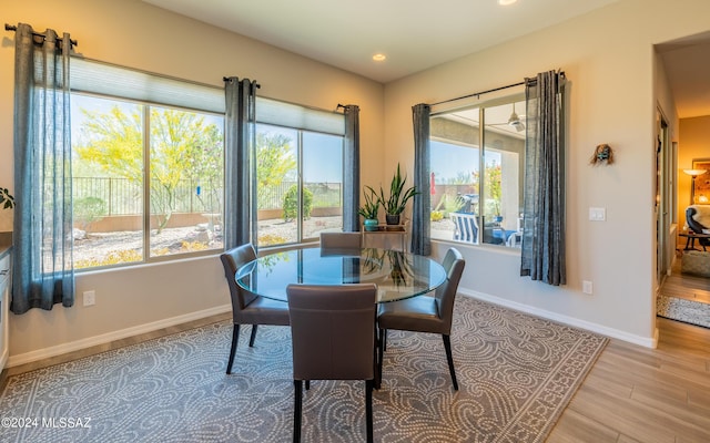 dining area with light hardwood / wood-style floors