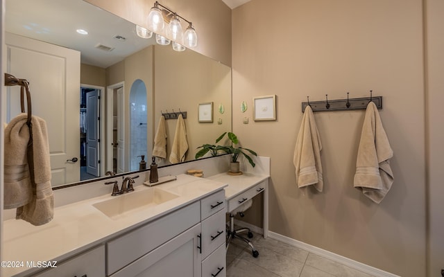 bathroom with tile patterned floors and vanity