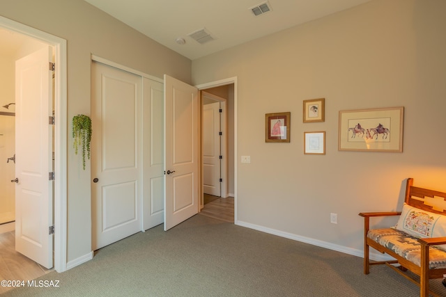 sitting room with light colored carpet