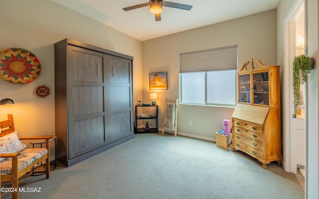 interior space featuring carpet flooring and ceiling fan