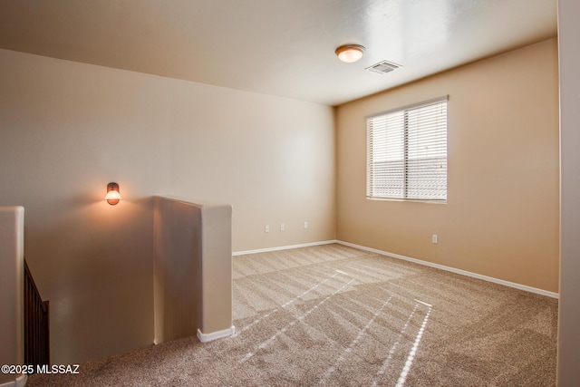 empty room with light colored carpet