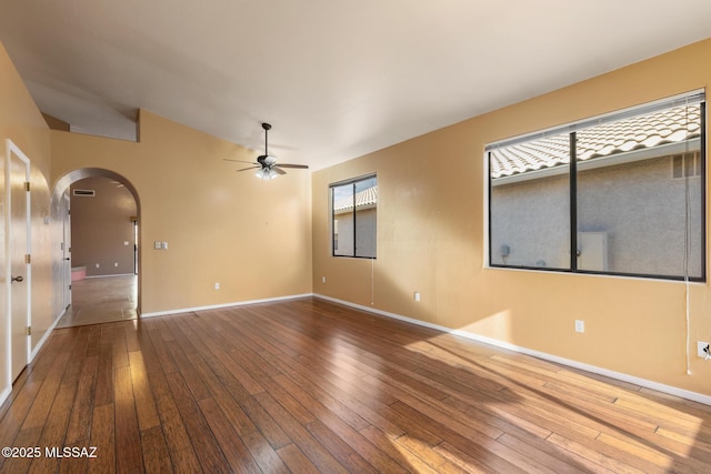 spare room featuring hardwood / wood-style floors and ceiling fan