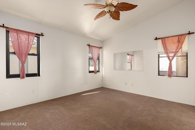 spare room featuring carpet flooring, ceiling fan, and vaulted ceiling