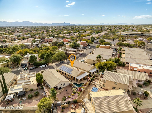 birds eye view of property featuring a mountain view