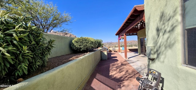 view of patio / terrace with a mountain view