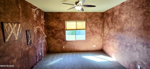 unfurnished room featuring carpet flooring and ceiling fan