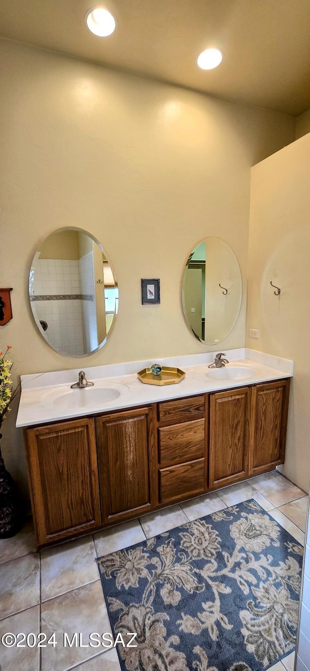 bathroom with tile patterned floors and vanity