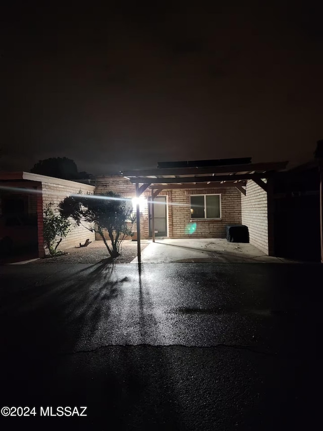 view of garage at night