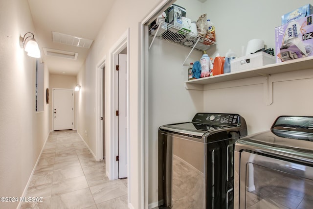 laundry area with separate washer and dryer