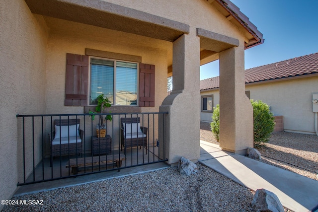 doorway to property featuring a porch