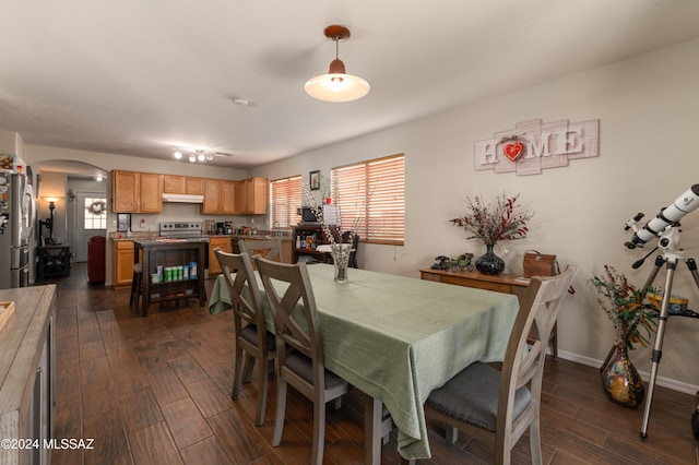 dining area with dark wood-type flooring