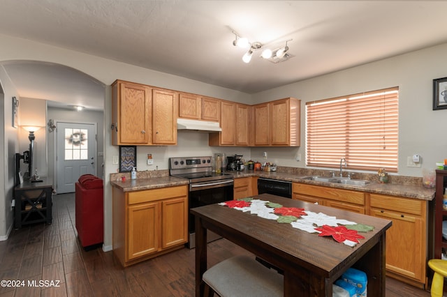 kitchen with sink, dark wood-type flooring, stainless steel range with electric stovetop, and black dishwasher