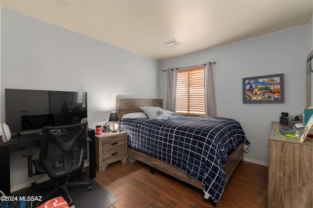 bedroom featuring dark hardwood / wood-style flooring