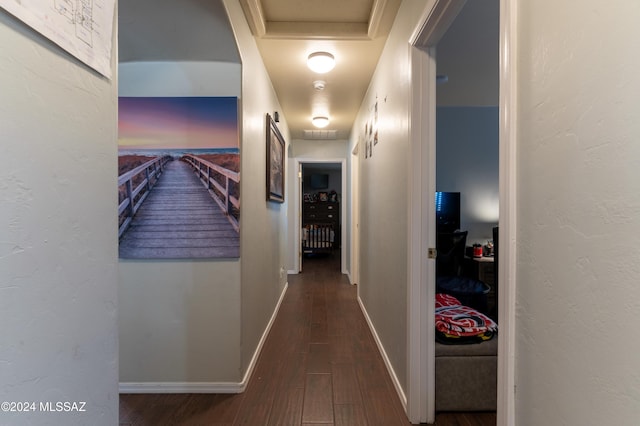 corridor with hardwood / wood-style floors