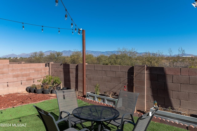 view of patio / terrace with a mountain view