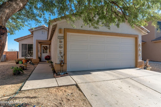 view of front of property featuring a garage