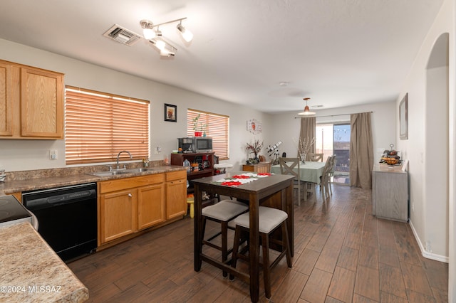 kitchen featuring dark hardwood / wood-style flooring, sink, black dishwasher, and light brown cabinetry