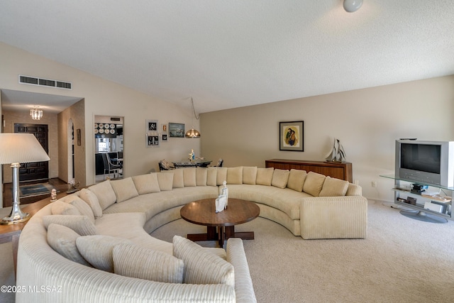 carpeted living room with high vaulted ceiling and visible vents