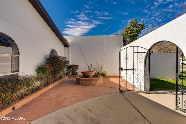 view of patio / terrace with a gate