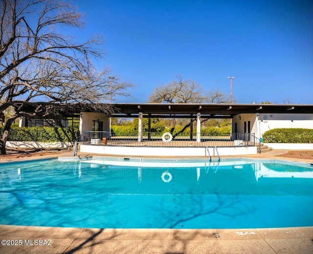 community pool featuring fence