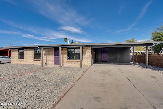 ranch-style home with a carport